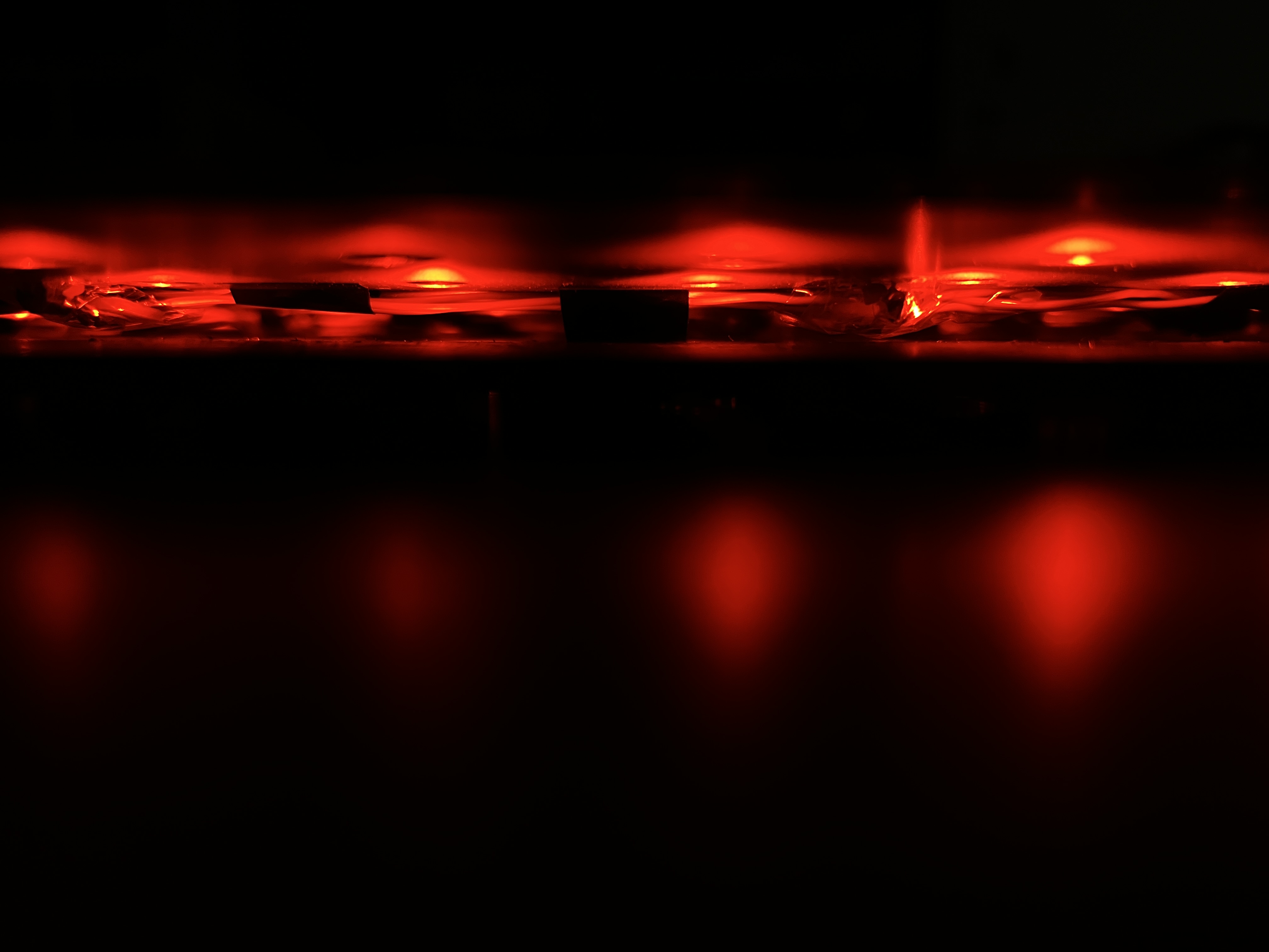 Layered macrocomputing assembly exposing computation through steel, temperature sensors, and an LED matrix